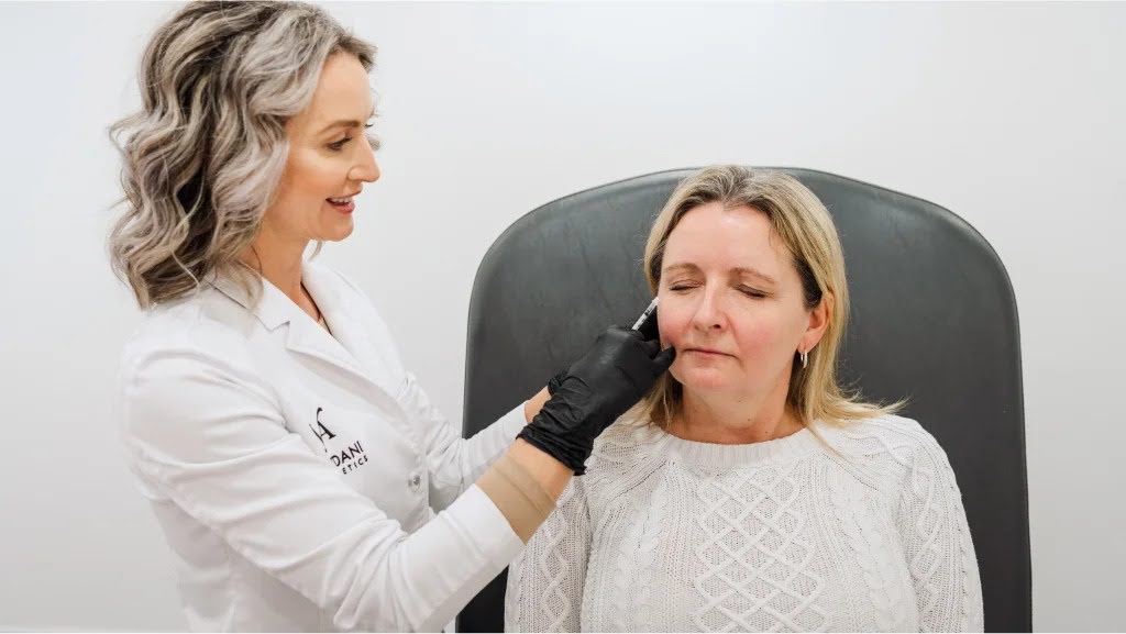 A woman getting Botox injected.